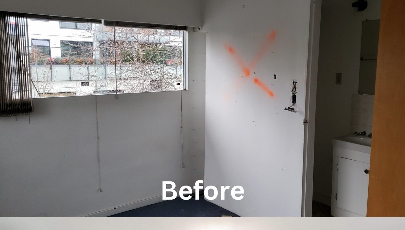 Dated basement rec room before renovation in North Vancouver